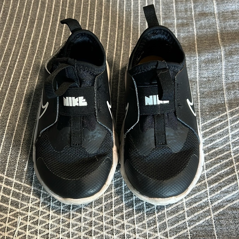 Black Nike kids tennis shoes
